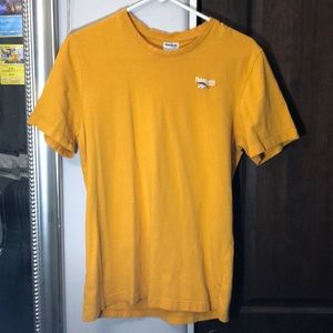 Yellow Reebok short sleeve shirt